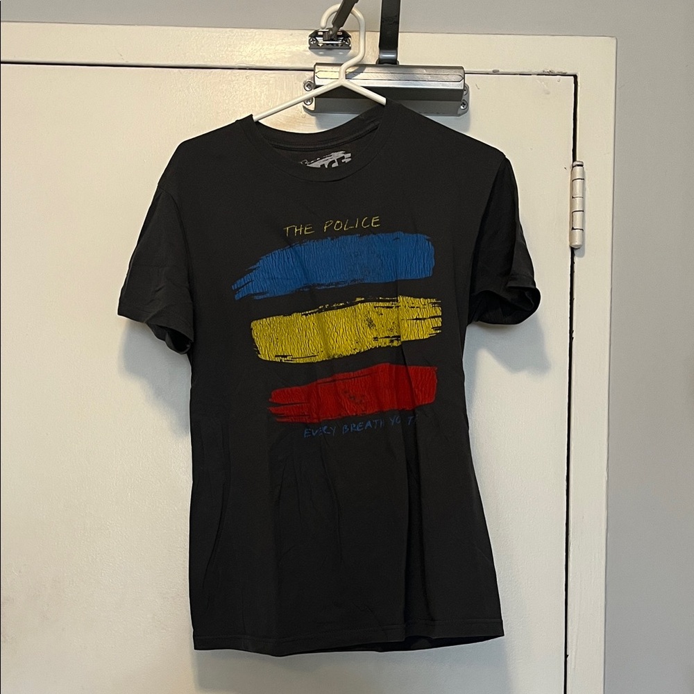 Vintage The Police tour bandBlack Graphic Tee with Blue, Yellow, and Red Accents